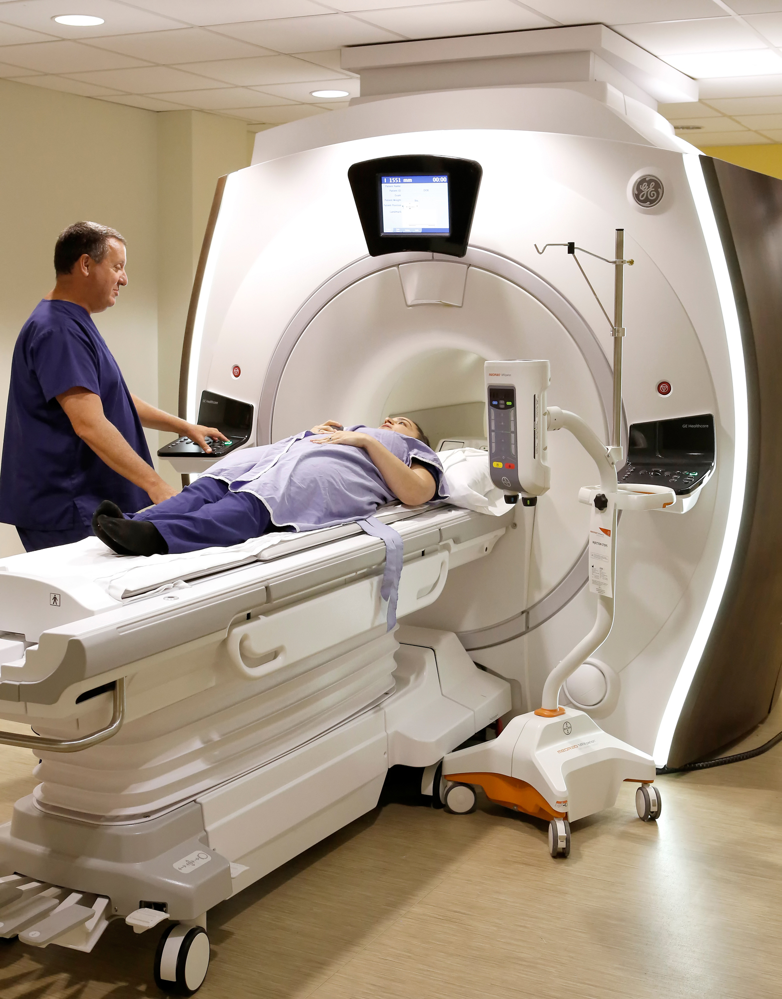 Radiologist performing MRI on patient