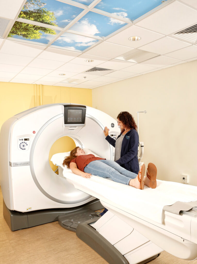 Radiologist performing CT scan on patient